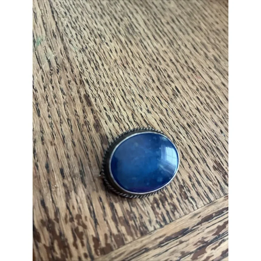 A Vintage Navajo Sterling Silver Sand Cast Brooch With A Lapis Cabochon
